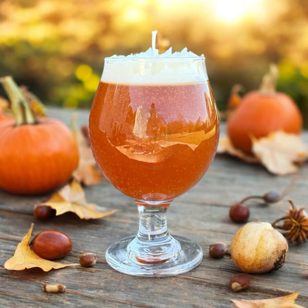  Glass pumpkin spice beer candle hand poured by CW Candle Co. with pumpkins and leaves on a wooden surface holiday thanksgiving fall