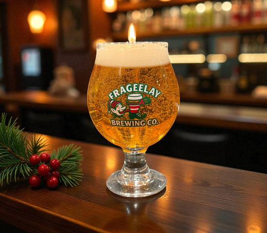 Glass of Frageelay Brewing Co. beer with a candle on a bar counter hand poured by CW Candle Co North Carolina 