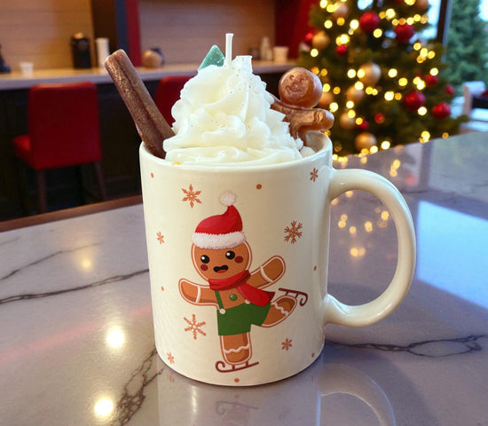 Beige Holiday Gingerbread mug candle topped with sculpted whipped wax, cookie embeds, and Christmas décor by CW Candle Co.
