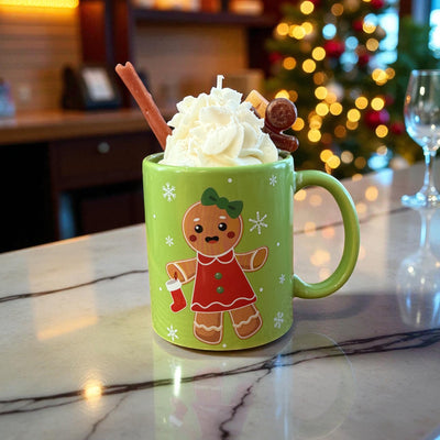 Green Holiday mug candle with whipped wax top, gingerbread figure, and Christmas tree backdrop Christmas Hearth scent by CW Candle Co.
